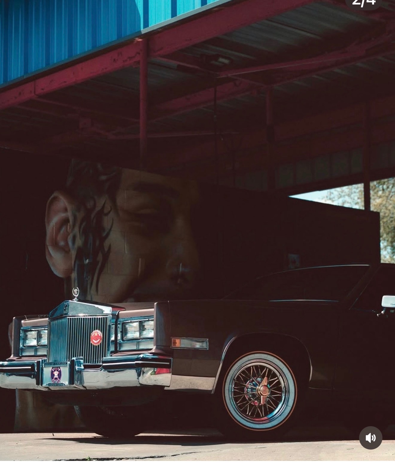 Desert sunset candy-painted Cadillac Eldorado in front of a mural