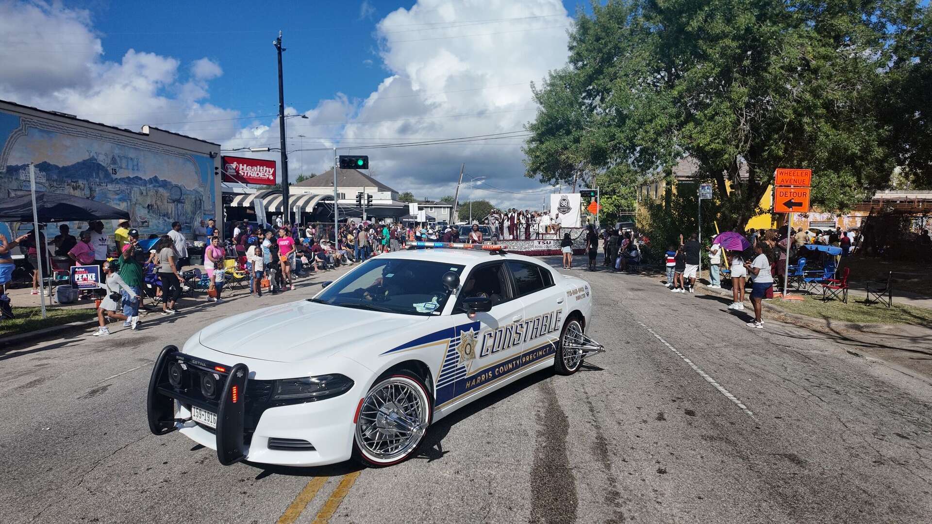 Harris County Constable patrol Cadillac sitting on gold swangas in Houston