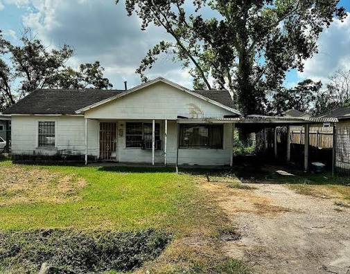The original Swishahouse, a small white Houston house with a carport, where the Northside tapes were made