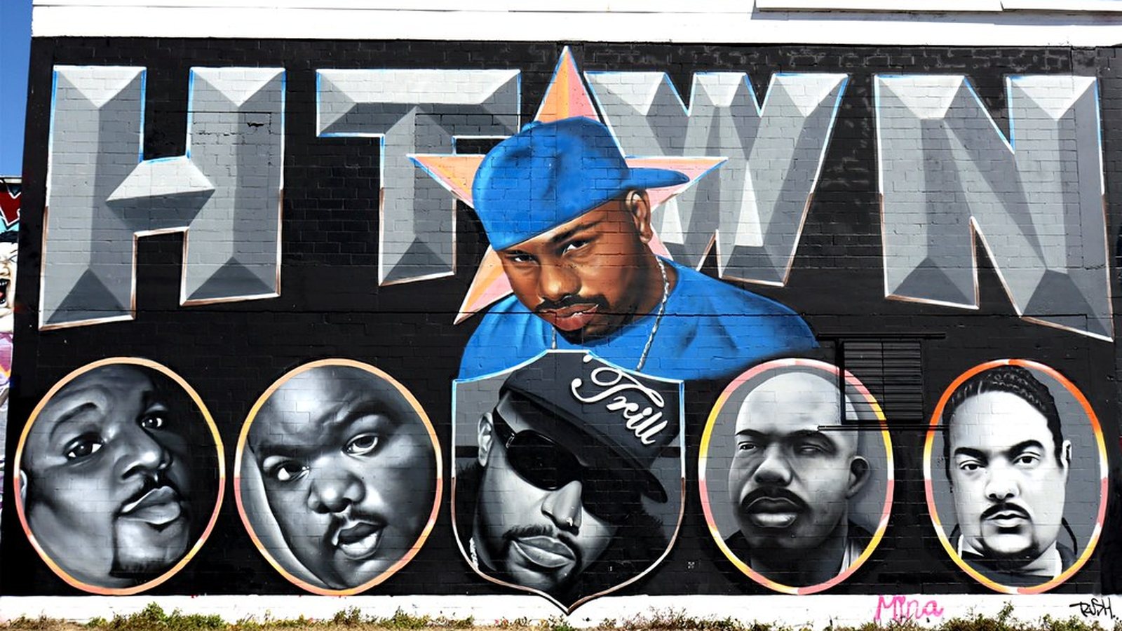H-Town mural of Houston rap legends painted on a Houston wall