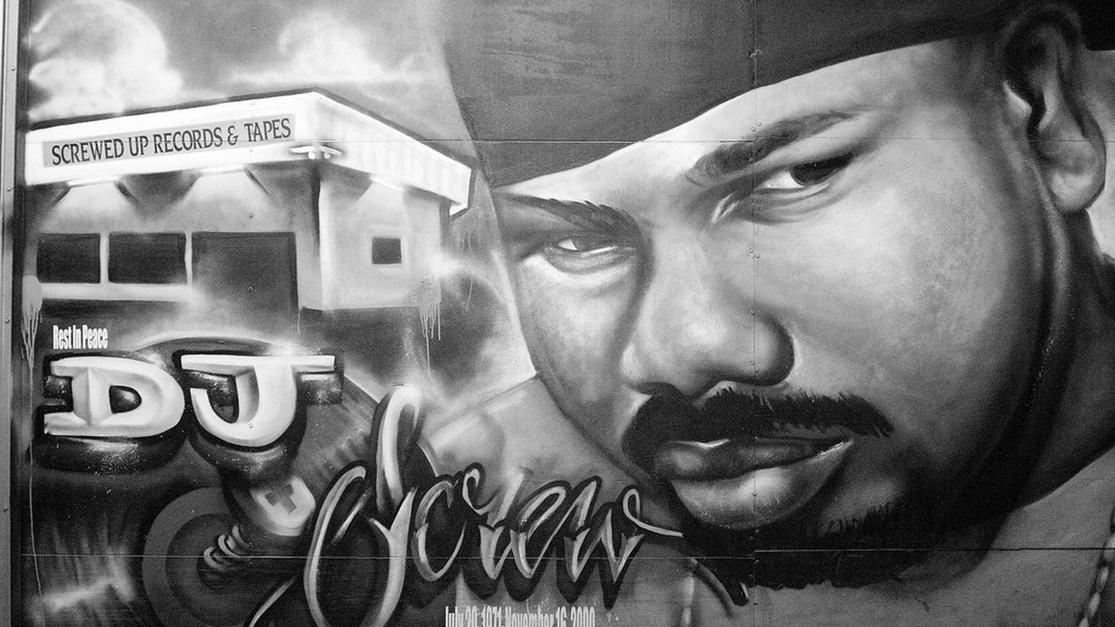 DJ Screw memorial mural painted on the wall of Screwed Up Records & Tapes in Houston