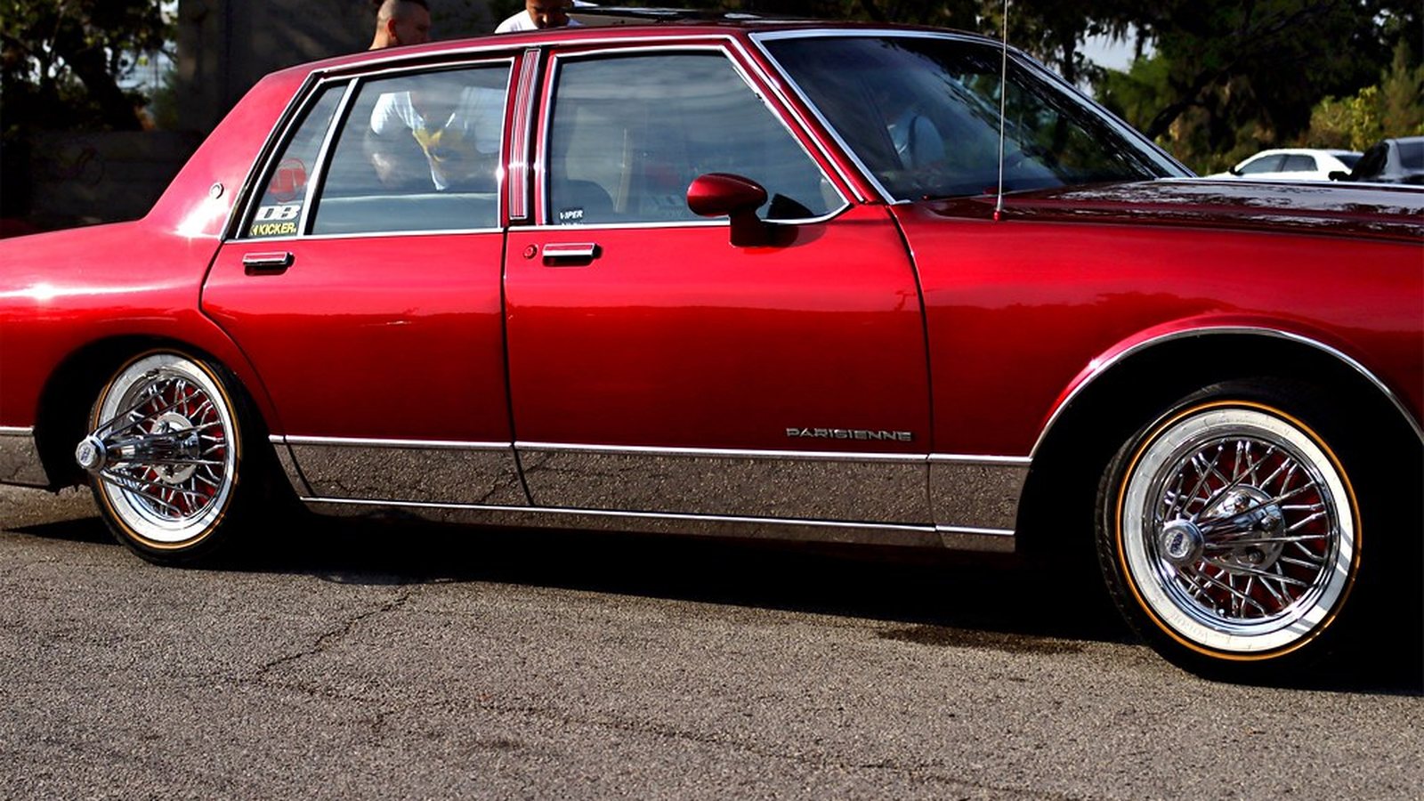 Candy red Pontiac Parisienne slab profile on wire wheels at a Texas slab meet
